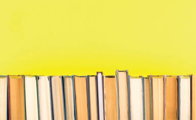 books-row-against-yellow-background_136401-2190